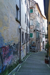 Fototapeta na wymiar Typical street in the historic center of Carrara, Tuscany, Italy