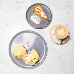 eggs benedict apple tart coffee latte