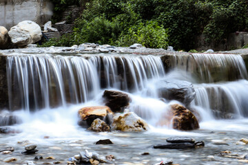 Long exposure shot of a low waterfall. Smooth flowing water giving a dreamy effect.