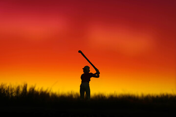 Miniature people toy figure photography. Silhouette of women golfer swing his stick at meadow field hill when sunset sunrise.