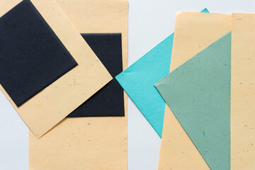 overlapping paper background (black, green, and yellow)