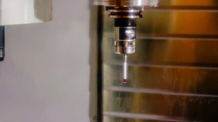 Close-up the CNC machine changes different drills. Metallic milling machine changing nozzles.