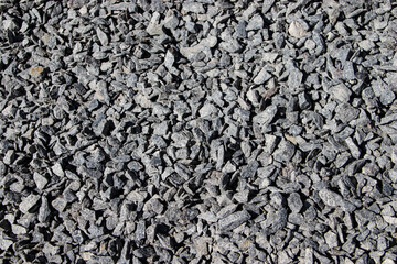 Natural Gray Granite Chippings, Macadam, Rubble or Crushed Stones Background Top View. 