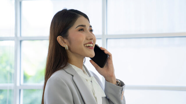 Asian Business Woman Talking Mobile Phone