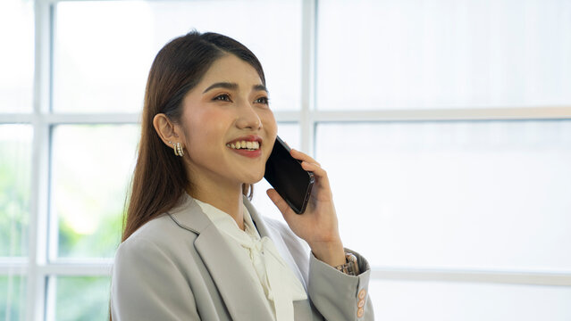 asian business woman talking mobile phone