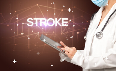 Doctor fills out medical record