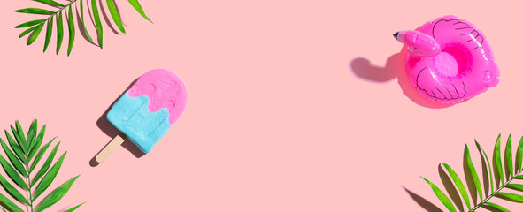 Summer concept with a flamingo float sunlight with a popsicle - flat lay © Tierney