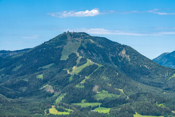 Fototapeta premium Beautiful view of Gemeindealp peak in Lower Austria from Bürgeralpe near Mariazell on a sunny summer day with blue sky cloud, Styria, Austria