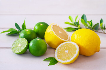 Lemon and lime on white wooden table © ritablue