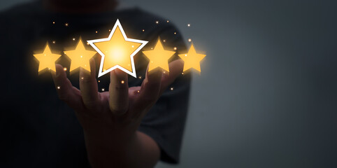 Businessman's hands holding a picture five  virtual stars.Give us a positive review for customer...