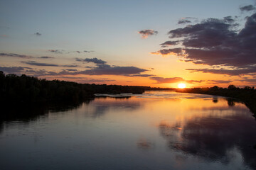 Fototapeta na wymiar sunset over the river in summer 