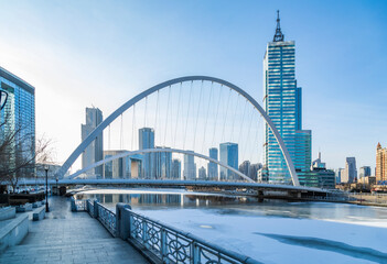 Fototapeta na wymiar Winter scenery of Tianjin bridge and buildings