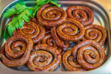 A pot full of grilled sausages.