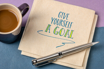 give yourself a goal - inspirational reminder on a napkin, goal setting concept
