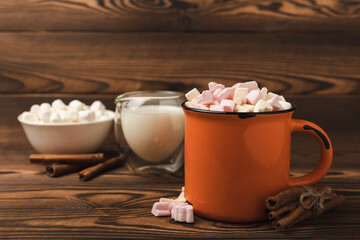 Cocoa drink on texture background. Hot chocolate with small marshmallows and spices. Winter warming drink concept. Space for copy. Space for text