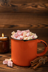 Cocoa drink on texture background. Hot chocolate with small marshmallows and spices. Winter warming drink concept. Space for copy. Space for text