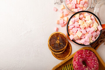 Cocoa drink on texture background. Hot chocolate with small marshmallows and spices. Winter warming drink concept. Space for copy. Space for text