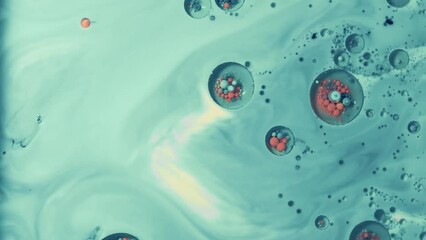 abstract blue and orange paint bubbels moving around fast
