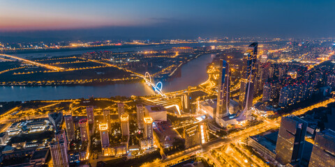 Night view of city skyline of Nanjing Eye Bridge and Poly Theater in Nanjing, Jiangsu, China
