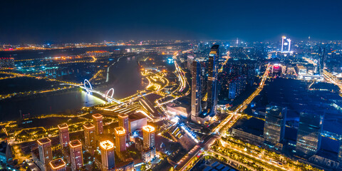 Fototapeta na wymiar Night view of city skyline of Nanjing Eye Bridge and Poly Theater in Nanjing, Jiangsu, China