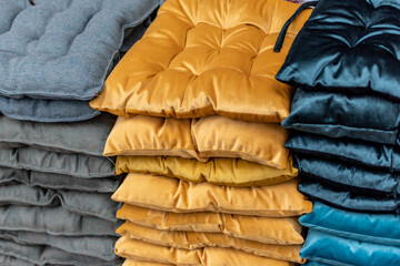 heap of chair cushion pads pillow in the market