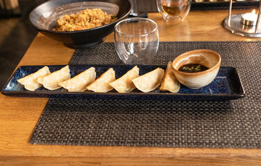 japanese food  in a restaurant. teapot with tea on the table