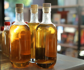 glass bottles with oil on the table