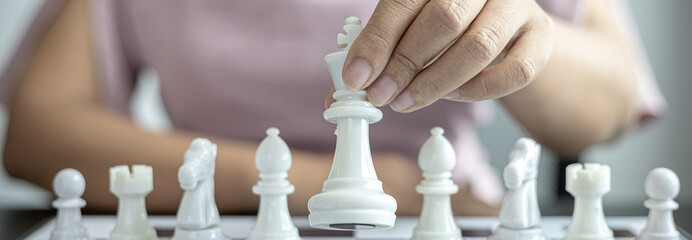 Businesswoman playing chess, Proactive business planning and marketing strategy just like playing...
