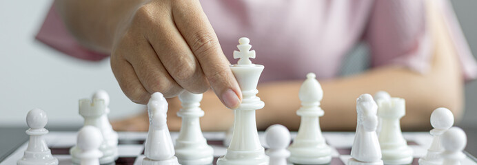 Businesswoman playing chess, Proactive business planning and marketing strategy just like playing...