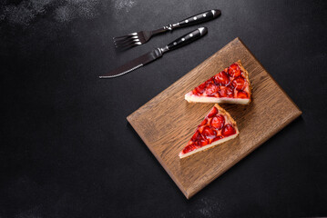 Delicious strawberry tart on concrete background, top view, copy space