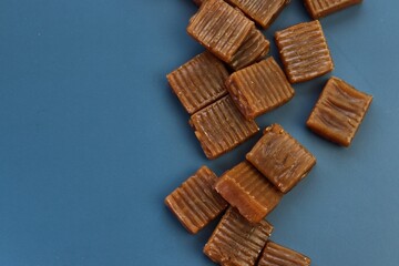 caramel candies on a blue background