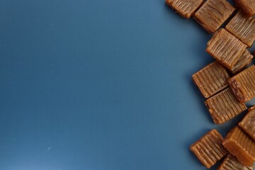 caramel candies on a blue background