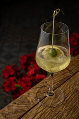 cocktail with ice and lemon on the table