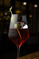 cocktail with ice and lemon on the table