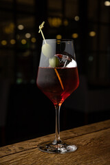 cocktail with ice and lemon on the table