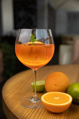 alcoholic cocktail with ice, orange, mint
