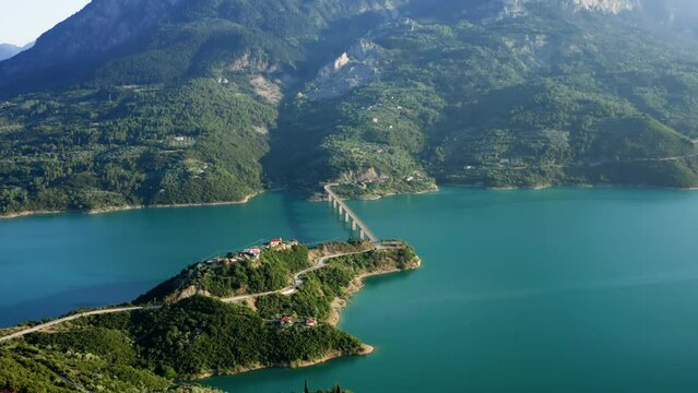 Aerial drone shot of breathtaking lake Kremaston (or Kremasta) with turquoise water and Episcopal Bridge, region of Evritania, Central Greece. 