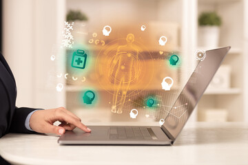 Doctor working on laptop with healthcare concept