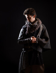 A guy in a steampunk or post-apocalyptic image, portrait on a black background