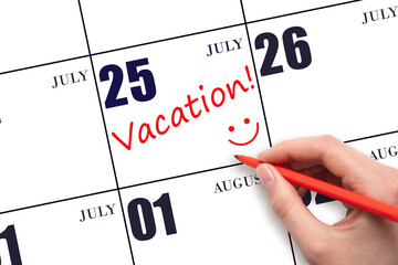 A hand writing a VACATION text and drawing a smiling face on a calendar date 25July. Vacation...