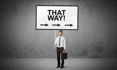 business person holding a traffic sign concept