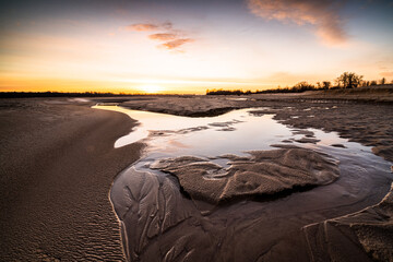 sunrise on the beach on the Vistula River.