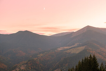 Amazing summer sunrise in Carpathian mountains. Colorful morning scene with first sunlight glowing hills and valleys