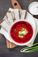 Ukrainian red national dish borsch, beet soup, added to Unesco list. Borscht with sour cream. Beetroot borscht with parsley.