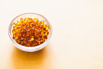 Vitamin D3 capsules. Medicine vitamins and dietary supplements. Selective focus. Close up of oil filled capsules suitable for: fish oil, omega 3, omega 6, omega 9, vitamin A, vitamin D, vitamin D3