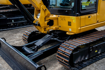 Details of hydraulicheavy duty equipment vehicle on display area of dealership