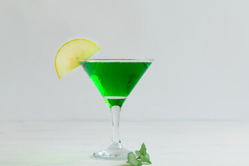 cocktail with mint.Apple cocktail mixed drink with vodka and apple slice. Apple martini cocktail on...