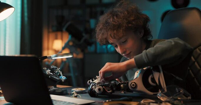 Boy works to create remote-controlled robot, uses soldering iron, tools, robotics enthusiast develops skills, learns to tinker.