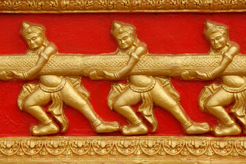 Wat Hawari sculpture detail : scene from the Ramayana : churning of the sea of milk