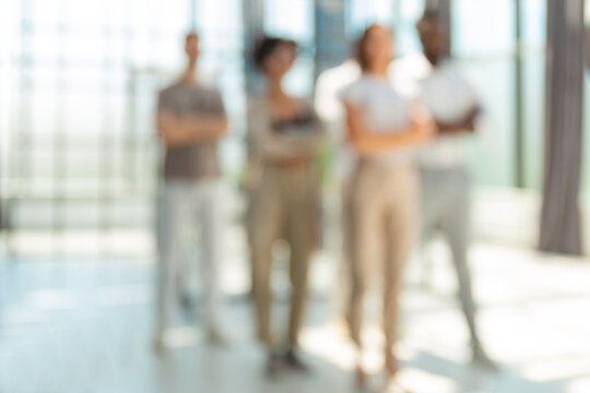 Blurred image of business people standing in the office